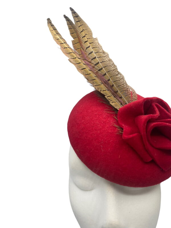Stunning cherry red felt headpiece with feather detail.